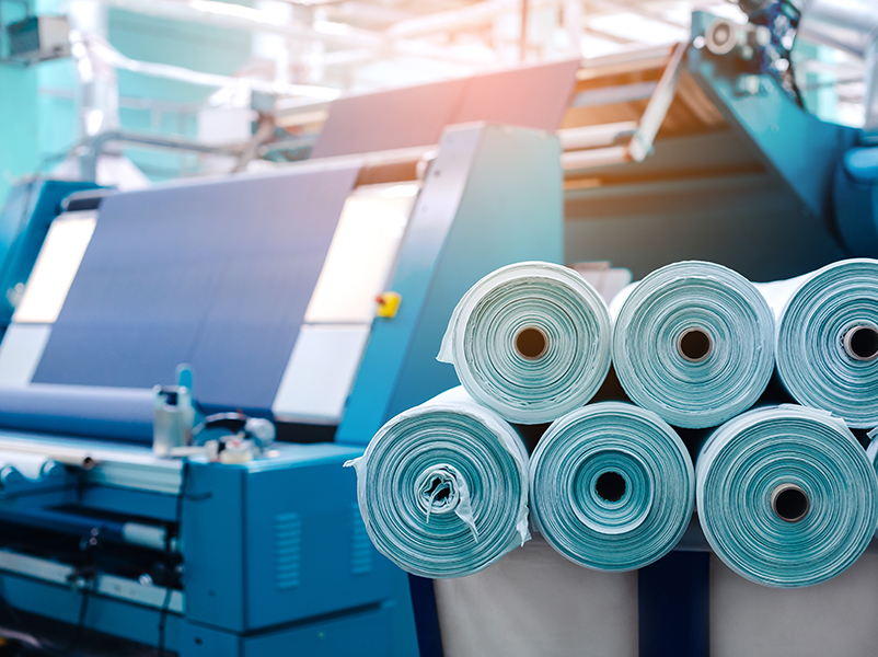 Microfibre Pollution in Fashion and Textiles 2 Rolls,of,industrial,cotton,fabric,for,clothing,cloth,textile,manufacture